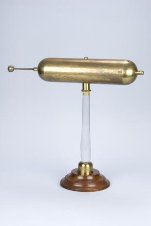 brass electric conductor on glass stand