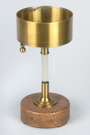 electrified brass cup on insulated stand