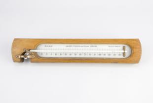 horizontal maximum thermometer on wooden frame
