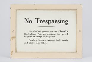framed "No Trespassing" sign from Harvard University