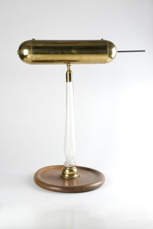 brass electric conductor on glass stand