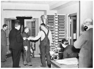 IBM ASCC-Mark I photo album: engineers moving in  Mark I storage counters