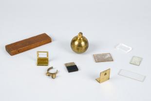 box of small brass and glass parts