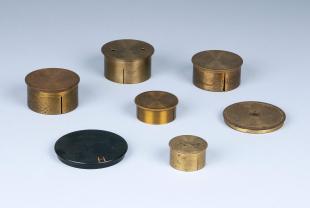 7 miscellaneous dust caps for telescopes and lenses
