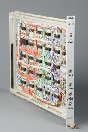 CAMAC-type electronic clock generator