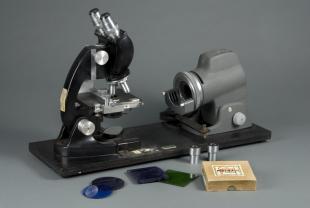 B&L laboratory binocular compound microscope on baseboard with Illuminator